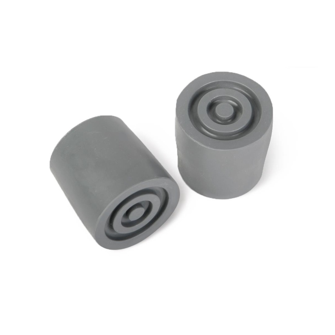 A pair of cylindrical gray Medline Walker Tip Replacements for 1" diameter walkers, each with circular end indents, are displayed at slight angles side by side on a white background.